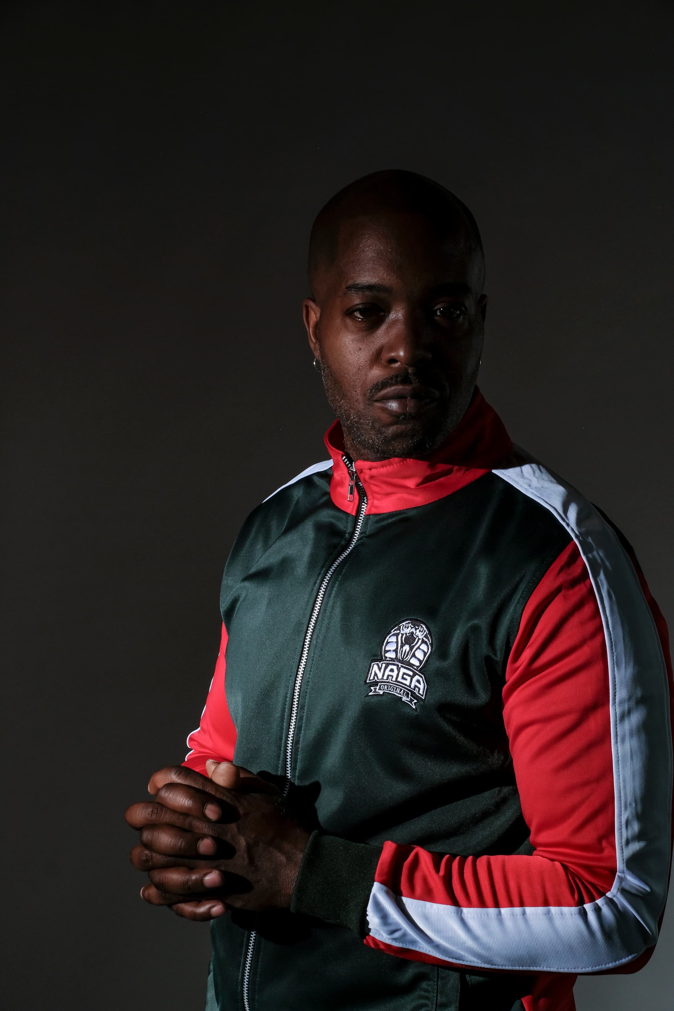 three men with dark background