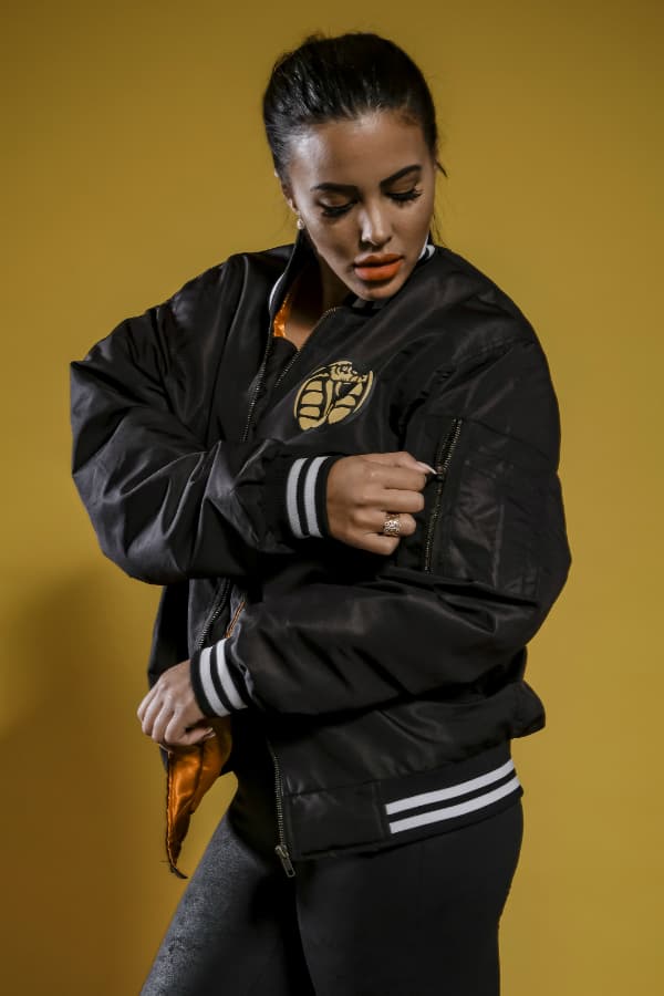 j mula posing with graffiti in background